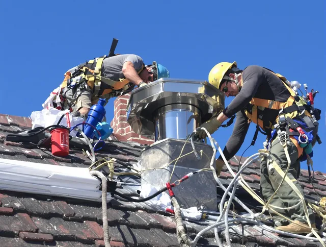Protective chimney cap installed by Tolland Chimney Sweep in Tolland, CT