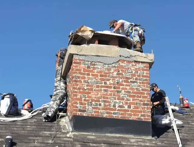 Tolland Chimney Sweep installing a custom chimney crown in Tolland, CT