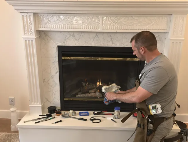 Tolland Chimney Sweep performing fireplace maintenance in Tolland, CT